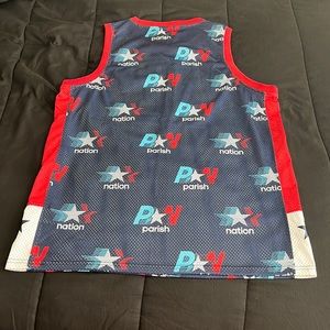 XLNever worn parish Nation athletic jerseys. Bought it brand-new red blue